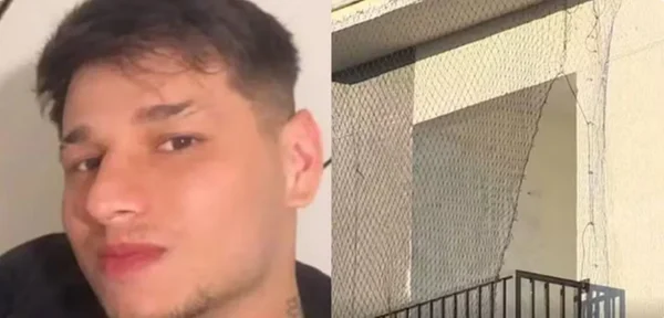jovem ao lado de rede de proteção