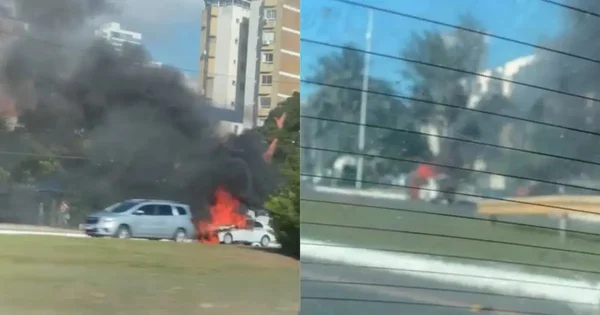 Imagem colorida de carro em chamas em uma rodovia de Salvador (BA) - Metrópoles