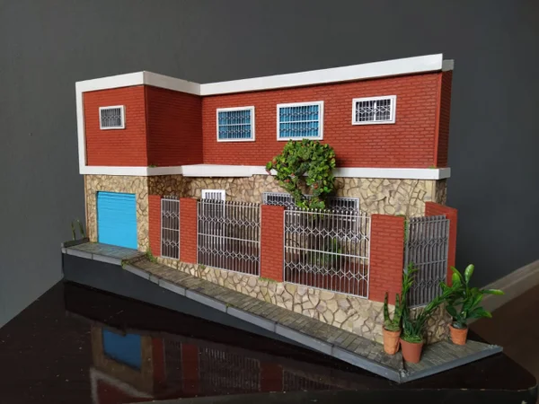 Miniatura da casa que foi vendida pela família
