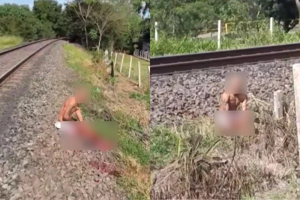Imagem colorida mostra bandido sentado perto de linha trem após perder a perna em tentativa de fuga - Metrópoles
