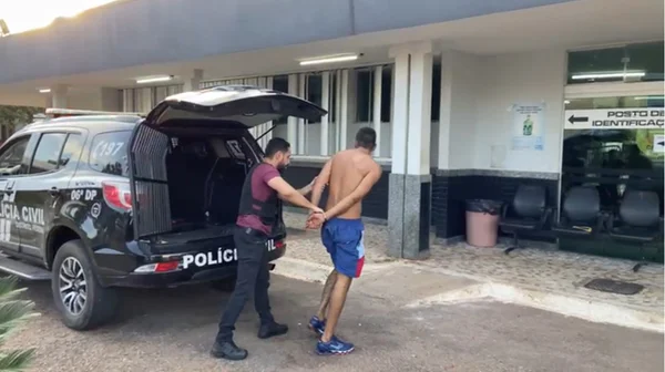 homem sendo preso