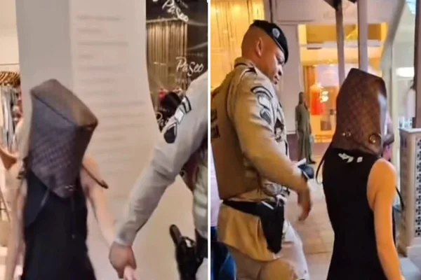 Imagem coloirda de mulher com bolsa na cabeça - Metrópoles