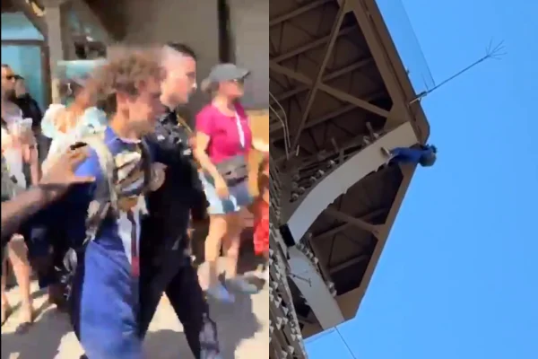 Imagem colorida, Homem escala Torre Eiffel e é preso após hastear bandeira dos EUA - Metrópoles