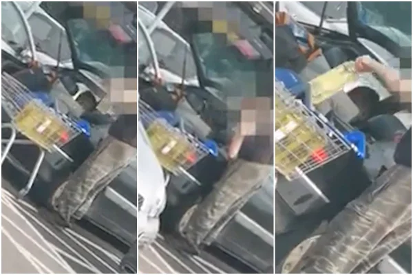 Homem abastece carro com óleo