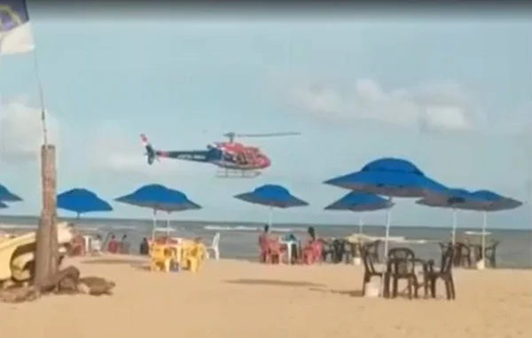 PE: helicóptero tentar afastar banhistas de áreas com risco de tubarão