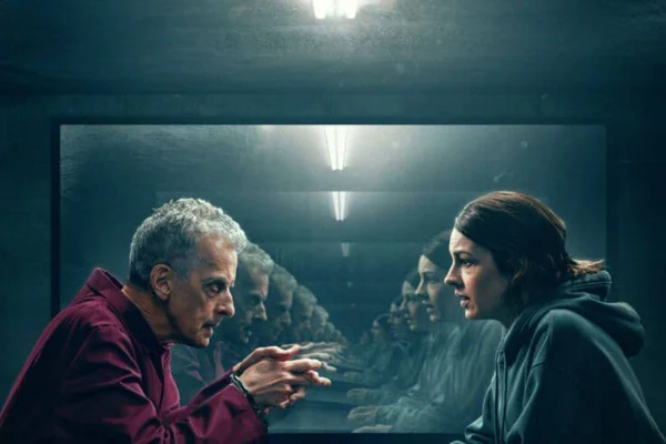 Imagem colorida de um homem preso conversando com uma mulher - Metrópoles