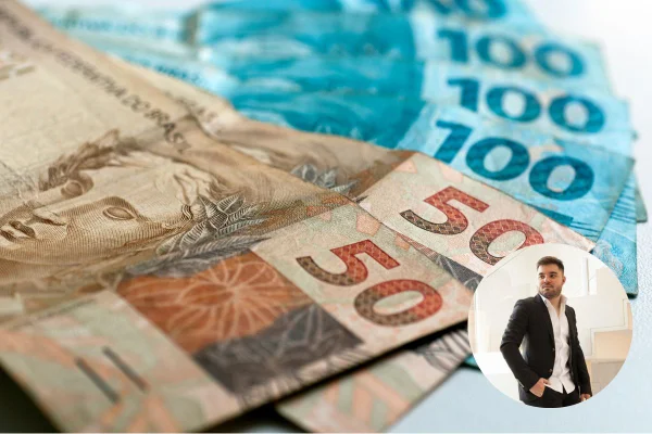 Cédulas de reais em valores de cinquenta e cem em mesa branca - Metrópoles