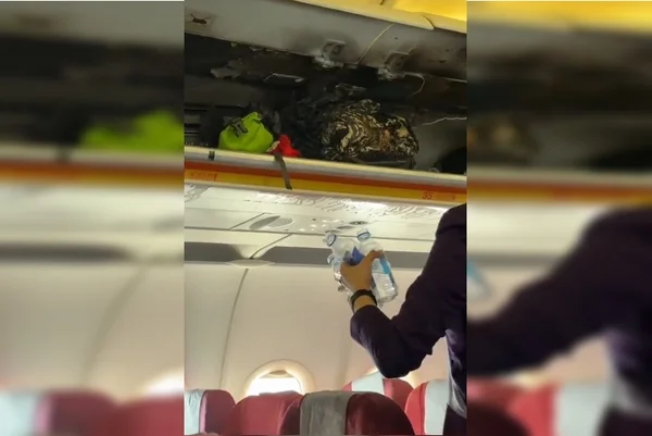 Mulher usa garrafa de água para apagar incêndio