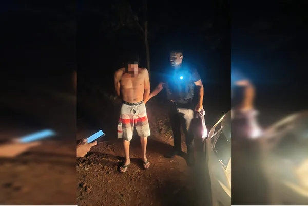 Homem de bermuda sendo algemado pelo Policial do Goiás