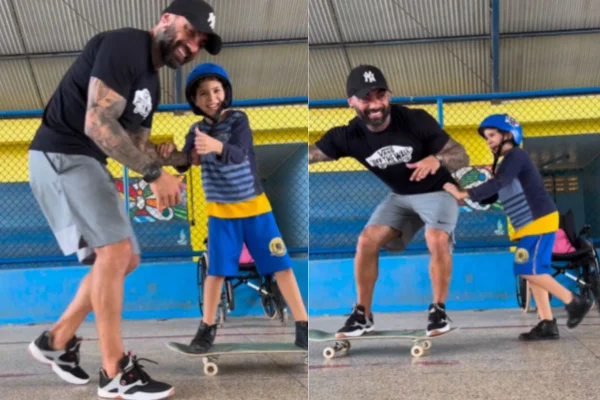 Foto colorida de um homem e uma criança em um skate - Metrópoles