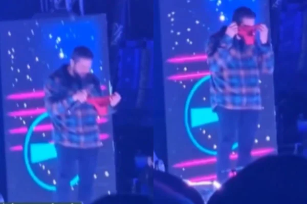 Henrique, da dupla com Juliano, cheira calcinha que fã jogou no palco