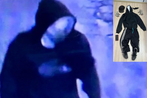 Reprodução azulada de câmera de monitoramento com homem usando moletom, cobrindo cabeça com capuz - Metrópoles
