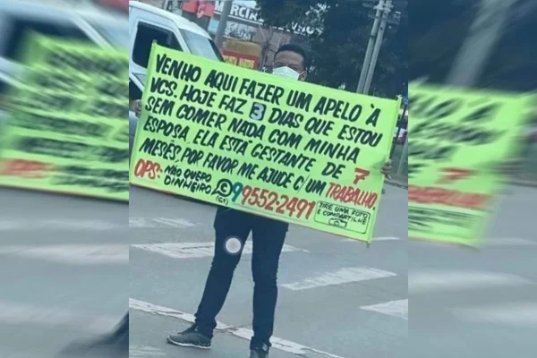 Homem viraliza após levantar faixa em sinal do DF: “3 dias sem comer”