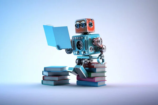 Robô sentado em pilha de livros e lendo um livro
