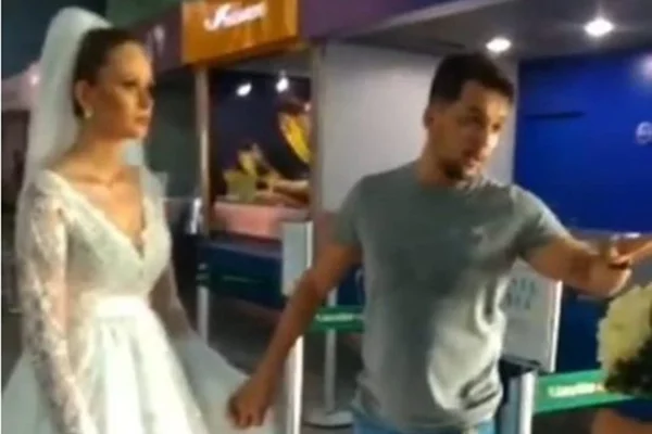 Vestida de noiva, mulher “foge com amante” em aeroporto