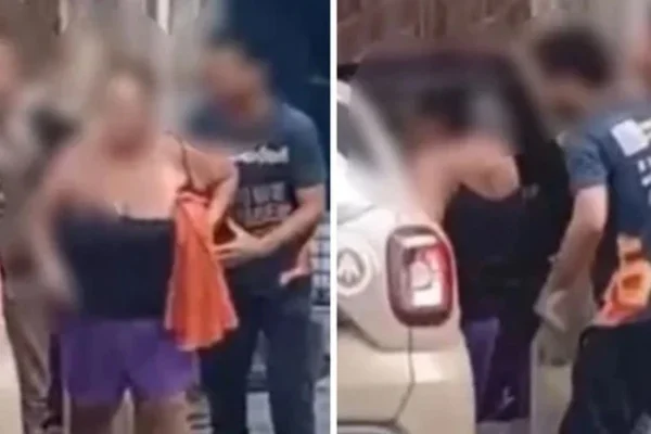 Imagem borrada de mulher segurando pano