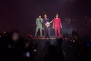 SAN DIEGO, CALIFORNIA - OCTOBER 17: (L-R) Musicians Nick Jonas, Kevin Jonas, and Joe Jonas of Jonas Brothers perform on stage at Pechanga Arena on October 17, 2019 in San Diego, California. (Photo by Daniel Knighton/Getty Images)