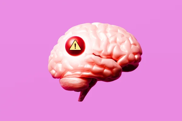 Ilustração colorida de cérebro humano com fundo rosa e um símbolo que indica; cuidado -Metrópoles.