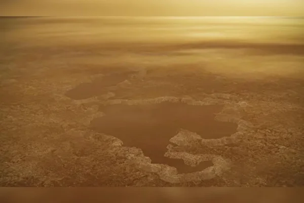 Ilustração de um grande lago marrom escuro visto do alto na atmosfera da lua de Saturno, Titã Esta concepção artística de um lago no polo norte da lua Titã, de Saturno, ilustra bordas elevadas e características semelhantes a muralhas, como visto pela sonda Cassini da Nasa
