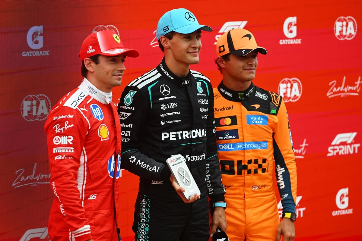 ZANDVOORT, NETHERLANDS - AUGUST 22: Sprint winner George Russell of Great Britain and Mercedes AMG Petronas F1 Team Second placed Charles Leclerc of Monaco and Scuderia Ferrari and Third placed Lando Norris of Great Britain and McLaren with thier Sprint trophies during the Sprint ahead of the F1 Grand Prix of Netherlands at Circuit Zandvoort on August 22, 2026 in Zandvoort, Netherlands. (Photo by Rudy Carezzevoli/Getty Images) ZANDVOORT, NETHERLANDS - AUGUST 22: Sprint winner George Russell of Great Britain and Mercedes AMG Petronas F1 Team Second placed Charles Leclerc of Monaco and Scuderia Ferrari and Third placed Lando Norris of Great Britain and McLaren with thier Sprint trophies during the Sprint ahead of the F1 Grand Prix of Netherlands at Circuit Zandvoort on August 22, 2026 in Zandvoort, Netherlands. (Photo by Rudy Carezzevoli/Getty Images)