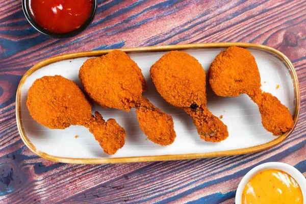 Pirulito de frango com molho agridoce de goiabada - Metrópoles