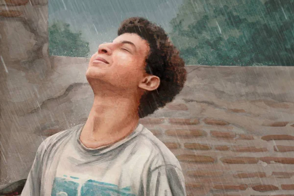 Imagem colorida de um menino tomando chuva - Metrópoles