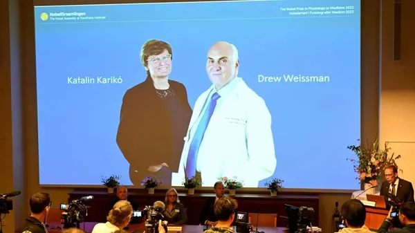 Imagem colorida de telão com os vencedores no Nobel de Medicina - Metrópoles