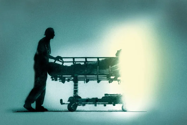 Ilustração de Enfermeira empurrando paciente deitado na maca do hospital para a luz brilhante - Metrópoles