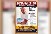Daniel fez cartazes com a foto do pai numa tentativa de localizá-lo após o terremoto na venezuela