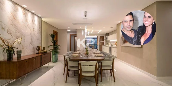 sala de jantar com lustre suspenso sobre a mesa