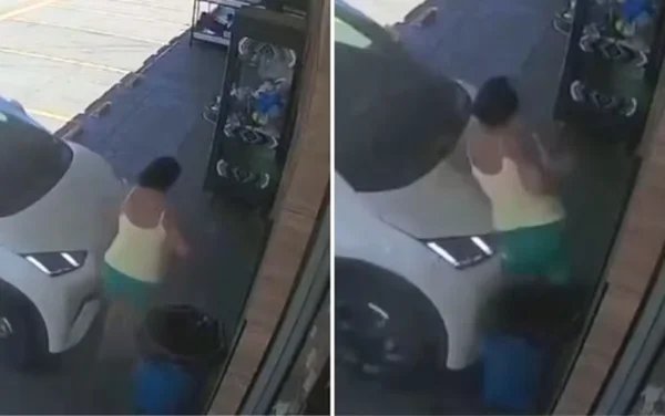 imagem colorida mulher prensada contra parede goiania