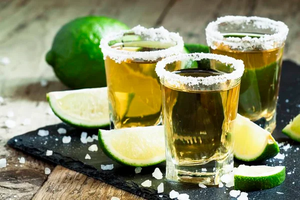 Gold Mexican tequila with lime and salt