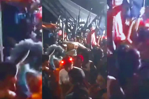 Imagem colorida de pessoas curtindo festa de Carnaval no Rio de Janeiro. Alguns simulacres de fuzil são vistos - Metrópoles